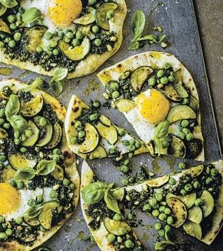 Sourdough pizza with eggs, courgettes & peas