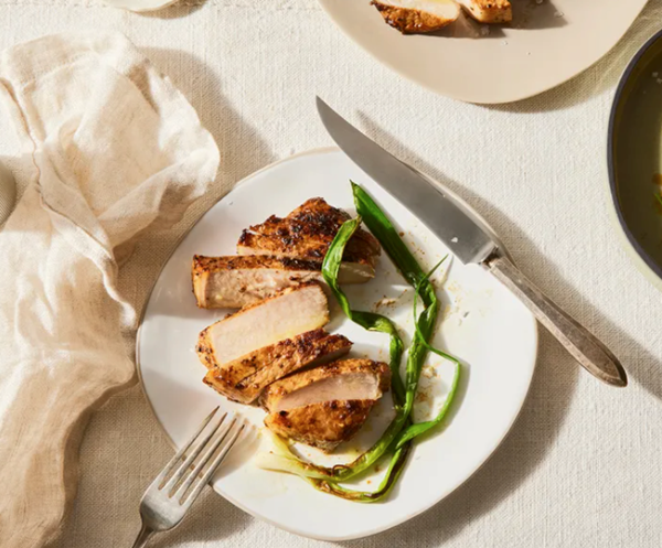 Soy-marinated baked pork chops with charred scallions