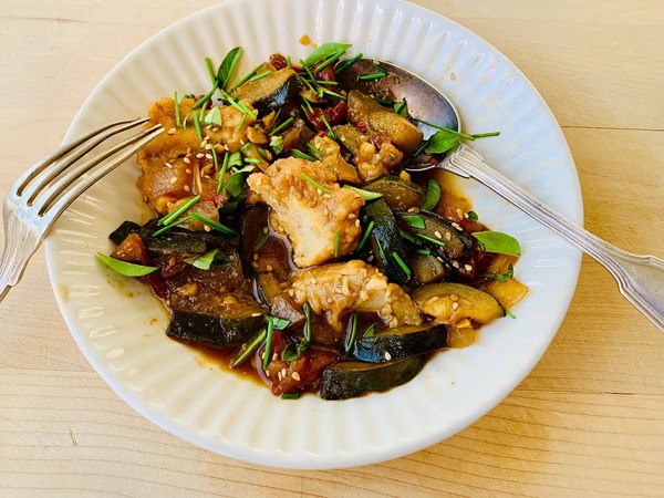 Soy-simmered tofu dumplings with zucchini and tomatoes