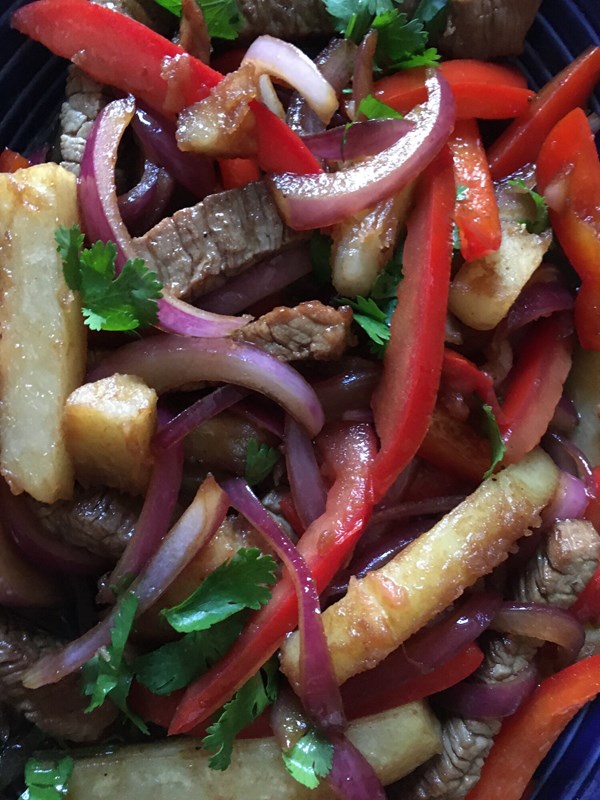 Soy stir-fried beef with rice (Lomo saltado con arroz)
