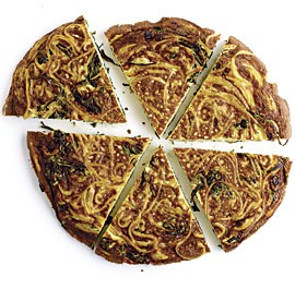 Spaghetti frittata with arugula and fresh herbs