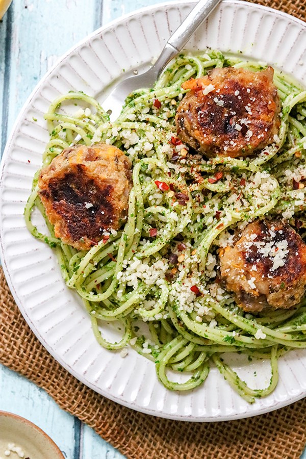 Spaghetti with arugula pistachio pesto and butternut squash polpette