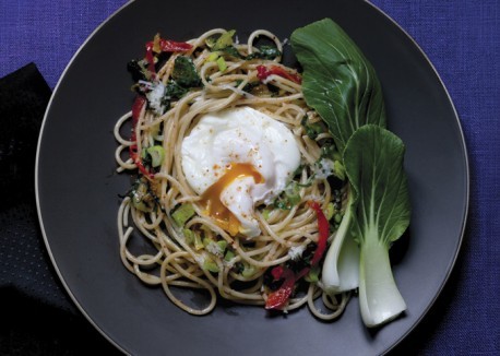Spaghetti with bok choy, poached egg, and Romano cheese