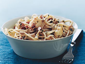 Spaghetti with cauliflower, green olives, and almonds