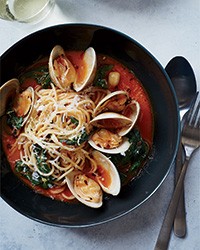 Spaghetti with clams and braised greens