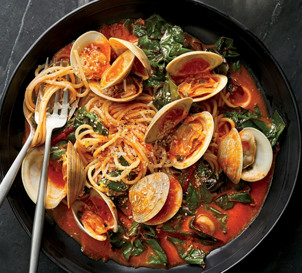Spaghetti with clams and braised greens