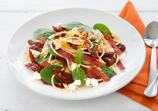 Spaghetti with crisp salami, sundried tomato and feta