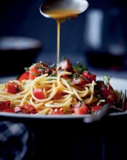 Spaghetti with garlic, tomato, basil, and beurre tomate