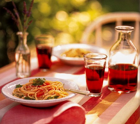 Spaghetti with marinated tomatoes, arugula, and ricotta salata