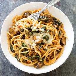 Spaghetti with mushrooms, kale, and Fontina