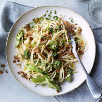 Spaghetti with purple sprouting broccoli, sultanas and oat pangrattato