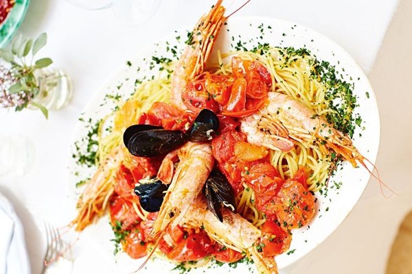 Spaghetti with rich tomato saffron sauce and seafood
