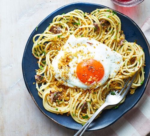 Spaghetti with smoked anchovies, chilli breadcrumbs & fried egg