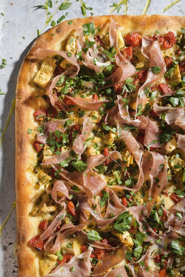 Spanish-style flatbread with roasted peppers, artichokes and prosciutto