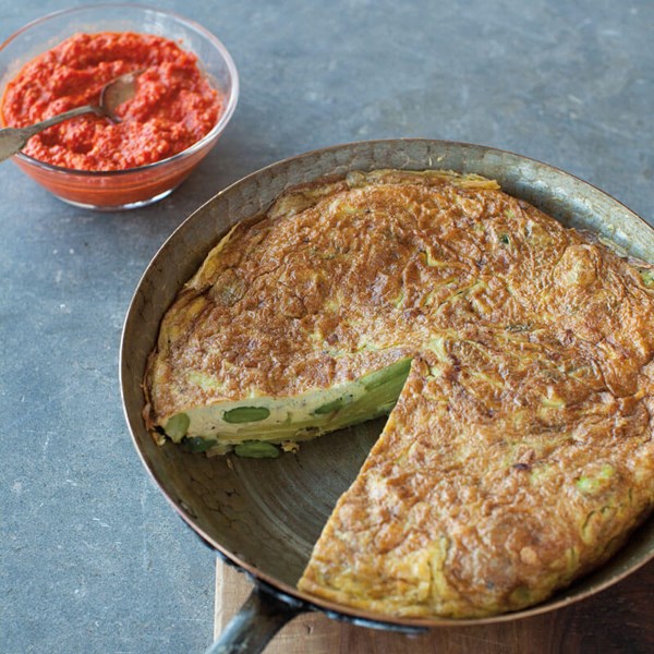 Spanish tortilla with favas, asparagus, and romesco