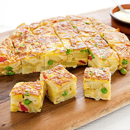 Spanish tortilla with roasted red peppers and peas