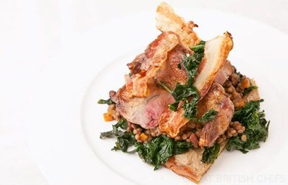 Spatchcock pigeon on bruschetta with cavolo nero, pancetta and porcini mushrooms