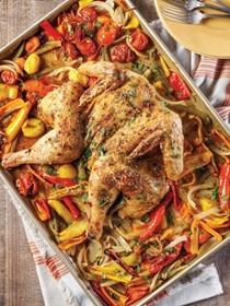 Spatchcocked chicken with peppers and tomatoes
