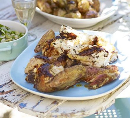 Spatchcocked chicken with soft cheese and basil