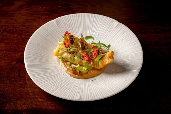 Spelt-battered pollock, satay sauce, pickled cucumber