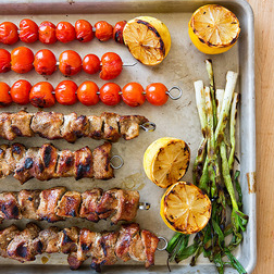 Spice-grilled pork skewers with grilled tomato relish