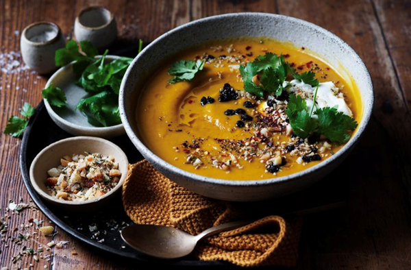 Spice-roasted pumpkin soup with macadamia dukkah