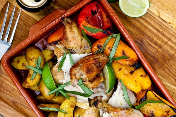 Spice-rubbed beer-can chicken with potatoes and sweet peppers