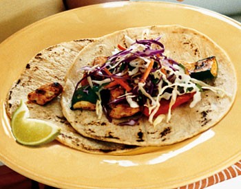 Spice-rubbed chicken and vegetable tacos with cilantro slaw and chipotle cream