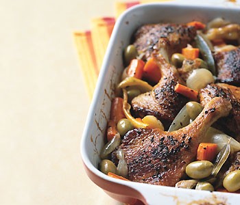 Spice-rubbed duck legs braised with green olives and carrots