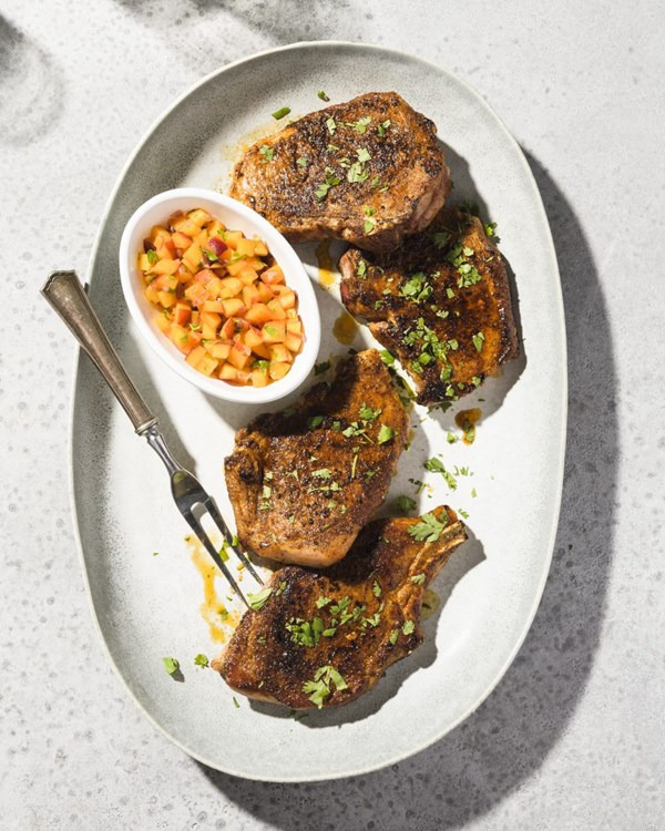 Spice-rubbed pork chops with peach pico de gallo