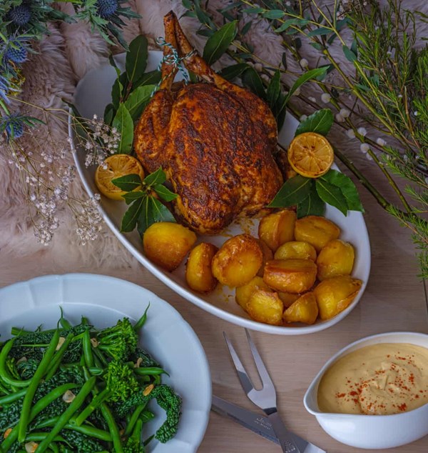 Spice-rubbed roast chicken and ackee sweetcorn cream