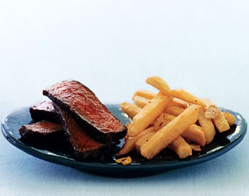 Spice-rubbed steak with quick garlic fries