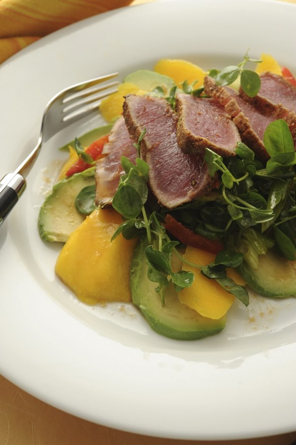 Spice-seared tuna with avocado, mango and pea shoot salad