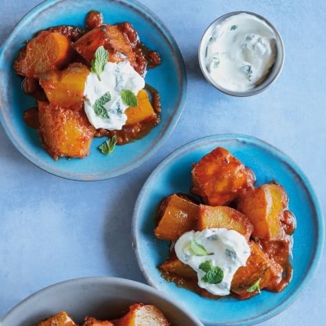 Spiced acorn squash with garlic-mint-yogurt sauce