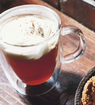 Spiced apple cider with rum whipped cream