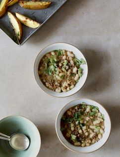 Spiced bean stew with rosemary potato wedges