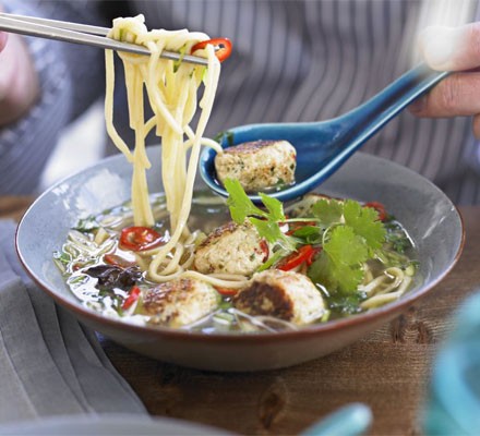 Spiced chicken meatballs with noodles, basil & broth