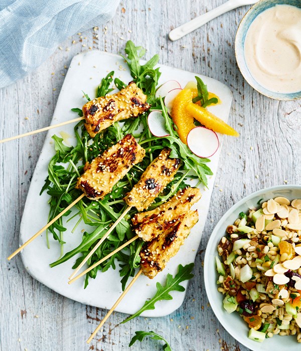 Spiced chicken skewers with barley, fruit and nut salad