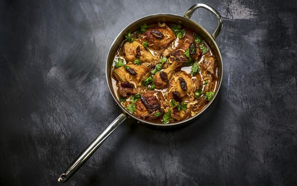 Spiced coconut chicken with dates, cinnamon and crispy shallots