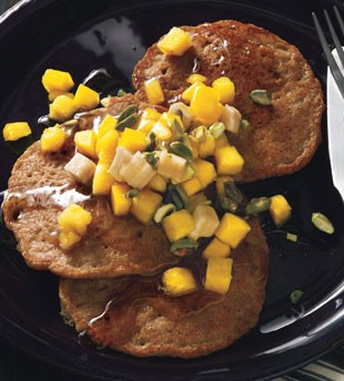 Spiced coconut pancakes with tropical fruit