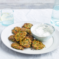 Spiced courgette and carrot fritters with raita