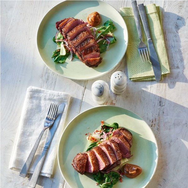 Spiced duck breast with umeboshi sauce and steamed bok choi