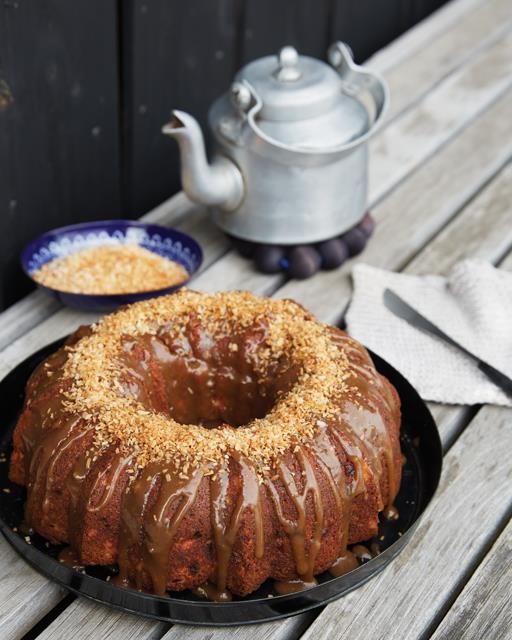 Spiced fig & cranberry Amaretto cake with caramel & coconut