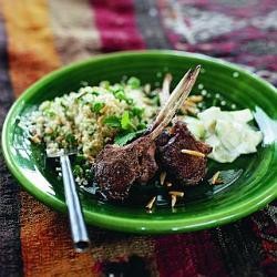 Spiced French lamb cutlets with herbed couscous, almonds & peas & lemon yoghurt cucumber salad
