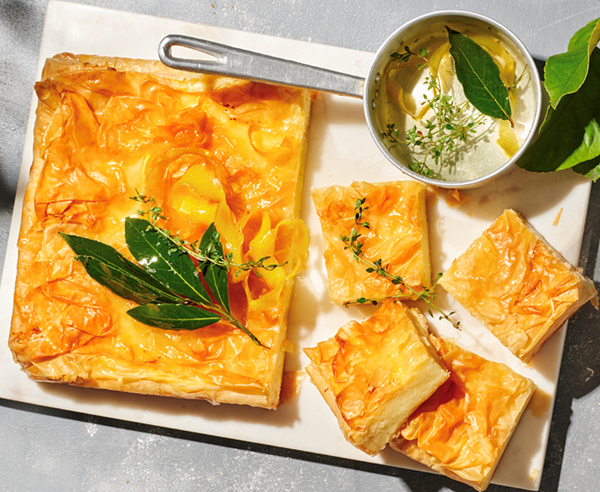 Spiced galaktoboureko with herb and lemon syrup
