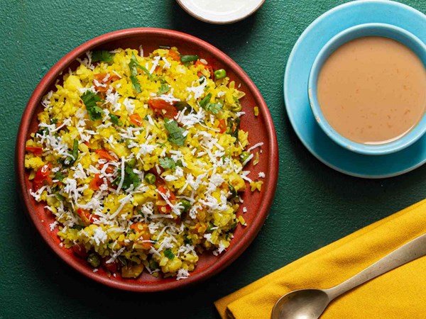 Spiced Indian flattened rice breakfast (Pohé)