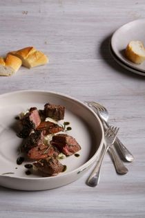 Spiced lamb rump with peppered rosemary oil