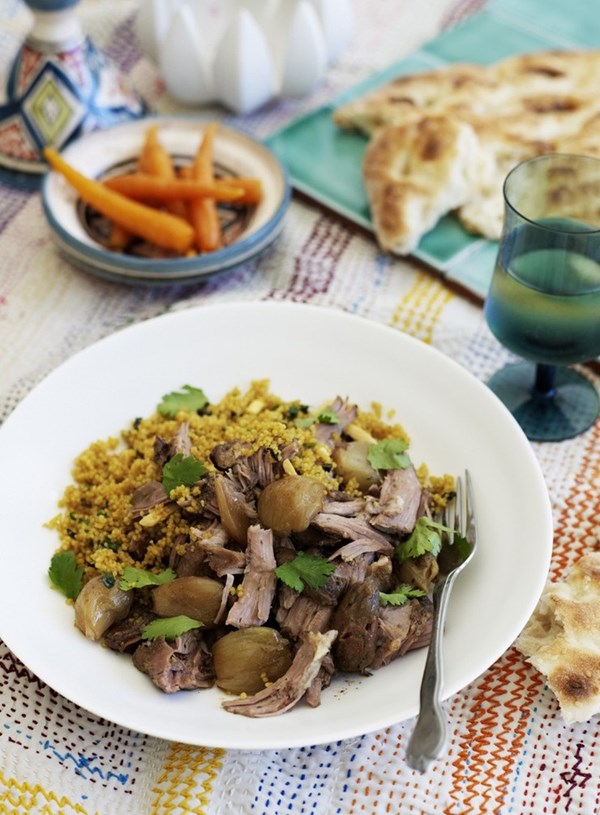 Spiced lamb shoulder with dates and shallots on couscous