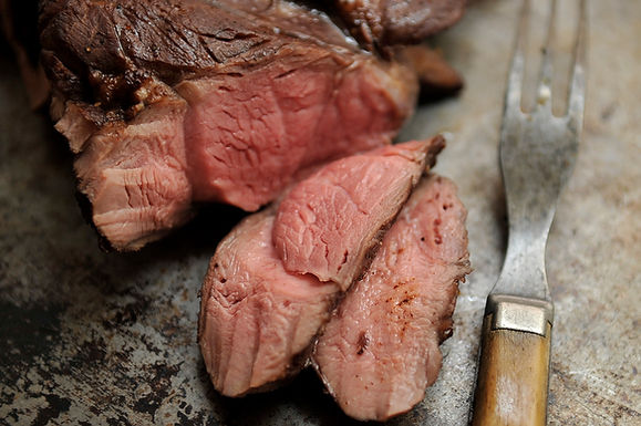Spiced leg of lamb on the grill