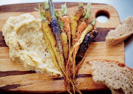Spiced little carrots with chickpea-sauerkraut puree